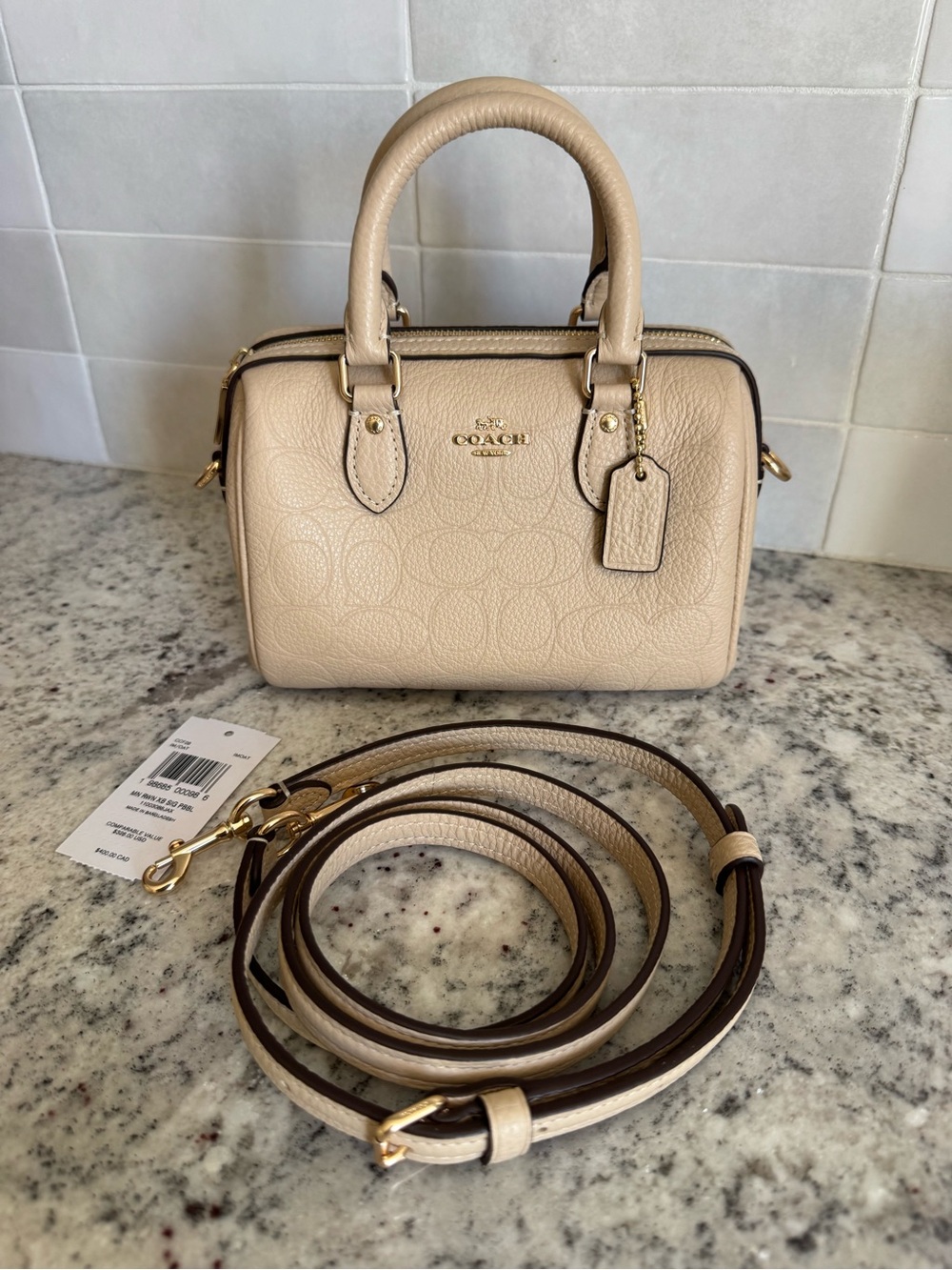 Coach Signature Pebbled Leather Mini Rowan in Oat